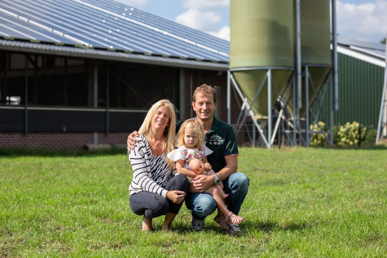 Farmer's family with solar panels